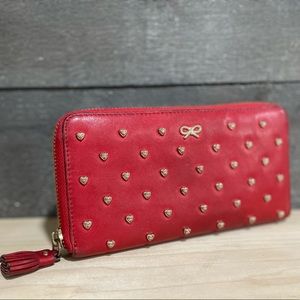 Anya Hindmarch red wallet.